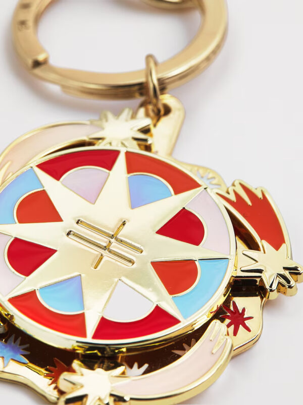 Harrods Spinning Star Keyring 側面角度,呈現金色金屬光澤與旋轉結構