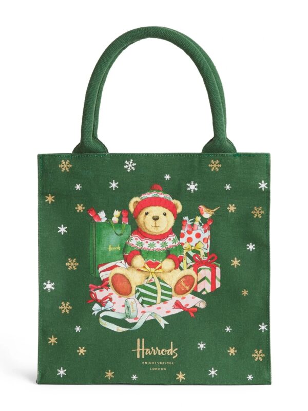 英國 Harrods 聖誕小熊手提袋正面,墨綠棉質袋身印有亨利熊與知更鳥節慶插畫及雪花圖案