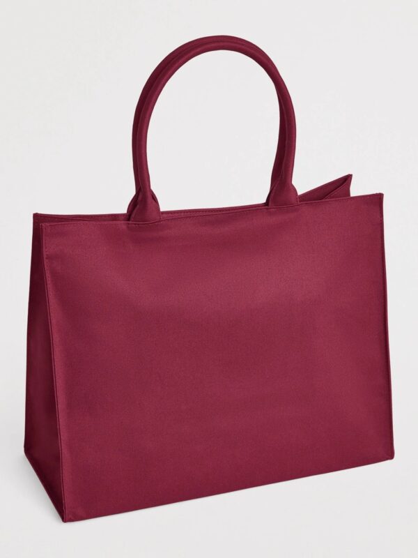 Harrods Logo Tote Bag 側面角度,展示雙頂提把與金色五金細節
