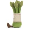 JCDB2610007-53-Amuseables-Asparagus-22cm_2-mc JELLYCAT Amuseables Asparagus 坐於桌緣擺設情境,雙腿自然懸晃