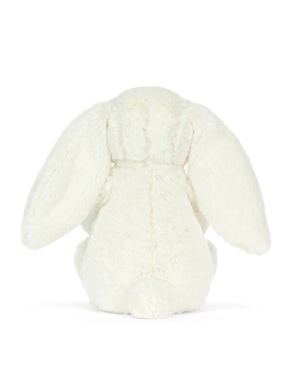 JCDB2610008-00-Cream-Bunny-with-Star-31cm_4-mc JELLYCAT 奶油兔與金蔥星星娃娃整體情境擺拍,呈現床邊陪伴與送禮包裝氛圍