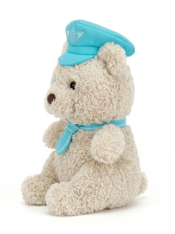 JELLYCAT Bartholomew Bear 飛行員小熊側面特寫,呈現極致柔軟棕色捲毛質感