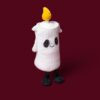 JCDB2630026-00_5 JELLYCAT Flickerty Candle 放置於萬聖節節慶桌面佈置場景,南瓜裝飾陪襯