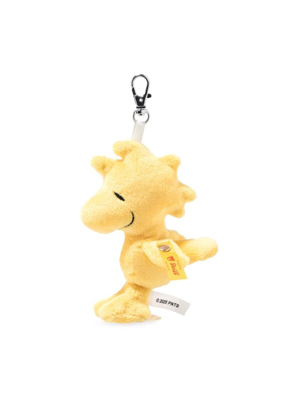 SFAK2610002-34_1-uni STEIFF Peanuts 伍德斯托克黃色絨毛娃娃吊飾正面,展示刺繡五官與 STEIFF 不銹鋼紐扣細節
